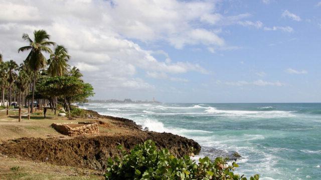 A shoreline in the Dominican Republic, where solid waste management challenges impact coastal ecosystems